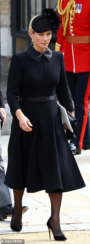 Zara Tindall wore a fitted Laura Green coat, complete with a belted waist and duchesse satin collar, paired with a floral hat by Juliette Millinery and suede pumps by Emmy London