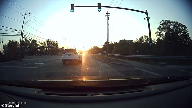 The other driver filmed the vehicle through his windshield as the child swerved into his lane at a green light