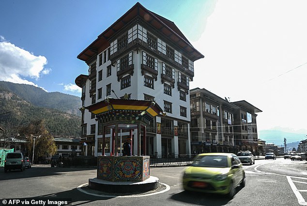 In this photo taken on January 10, 2024, a traffic cop directs traffic in Thimphu, the capital of Bhutan.