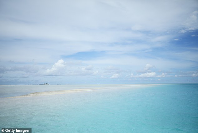 Tuvalu, formerly known as the Ellice Islands, is located in the Pacific Ocean, about halfway between Hawaii and Australia. Pictured: View out to sea from Funafuti