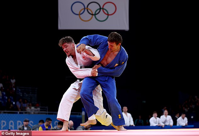 The IJF reported that Majdov (right) had been suspended for breaking a number of their rules, including making the sign of the cross during a match.