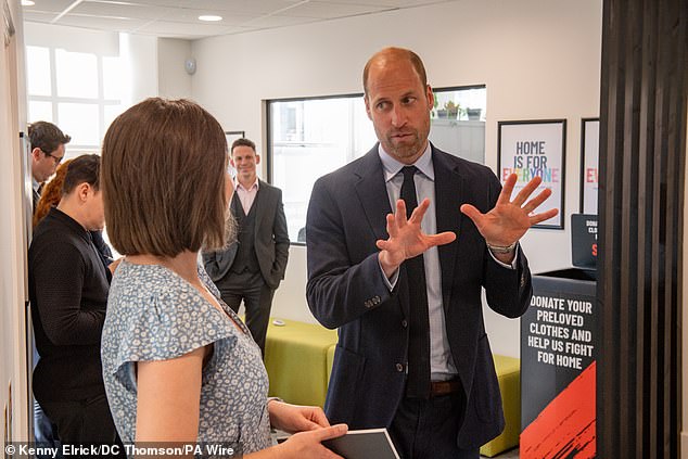 Prince of Wales, known as the Duke of Rothesay in Scotland, with community manager Iona Rennie as he meets homelessness workers during a visit to Shelter