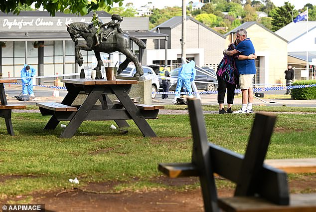 Relatives are seen laying flowers outside the Royal Hotel in Daylesford in November 2023