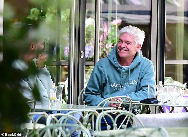 He appeared to be in good spirits when he was spotted dining al fresco with his pal Scott and Molly May, 31, outside the Ham Yard Hotel in Soho, London on Thursday.