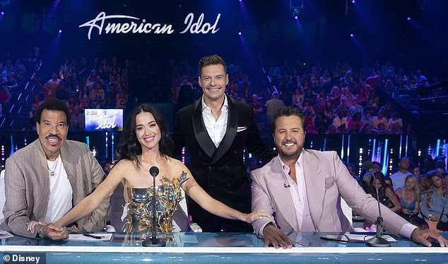 Carrie now replaces outgoing judge Katy Perry, pictured with fellow judges Lionel Richie (left) and Luke Bryan (right) and host Ryan Seacrest (second from right)