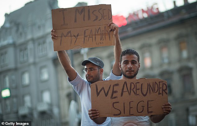 Migrants protest outside Keleti station in Budapest, which was closed to them in September 2015 (file photo)