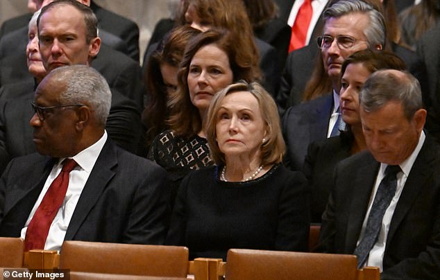 Justice John Roberts, front right, with his wife Jane Sullivan, center, at the memorial service for former Chief Justice Sandra Day O'Connor last December