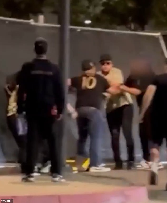 Another clip shows Urias waving in her direction before bystanders try to intervene