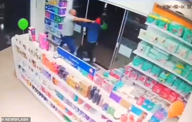 The salesperson tried to disable the robbers as they fled the store