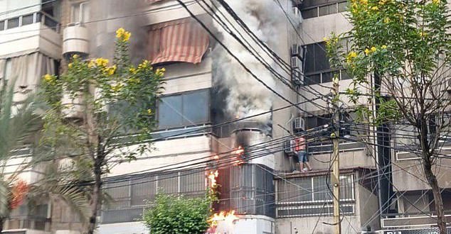 Flames engulf a building in Lebanon during explosions