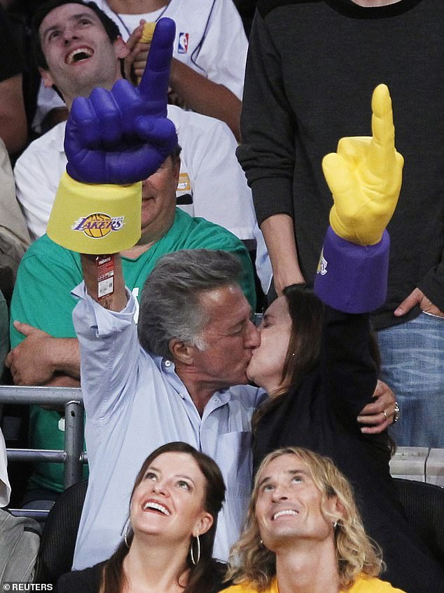 Keeping the romance alive: The couple is seen sharing a passionate kiss during the 2010 NBA Finals