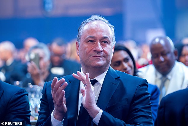 Second Gentleman Doug Emhoff applauds as Democratic presidential candidate U.S. Vice President Kamala Harris speaks at the Congressional Black Caucus Foundation's Phoenix Awards