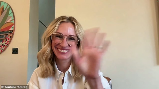 Pretty Woman star Julia Roberts waves to the crowd in person and online as Oprah hosts a large-scale event for Vice President Kamala Harris on Thursday night