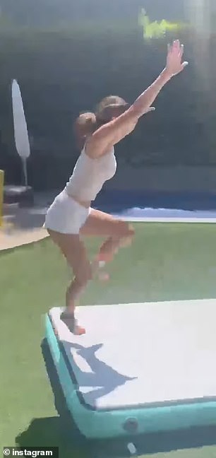 She added footage of the teen showing off her impressive tumbling skills on a training mat in the backyard of their Los Angeles home