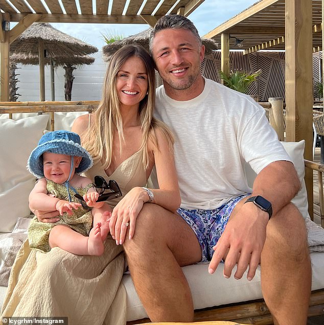 Burgess (pictured with partner Lucy Graham and their daughter Robbie) is a debutant coach at Warrington but has led the club to the finals in his first year