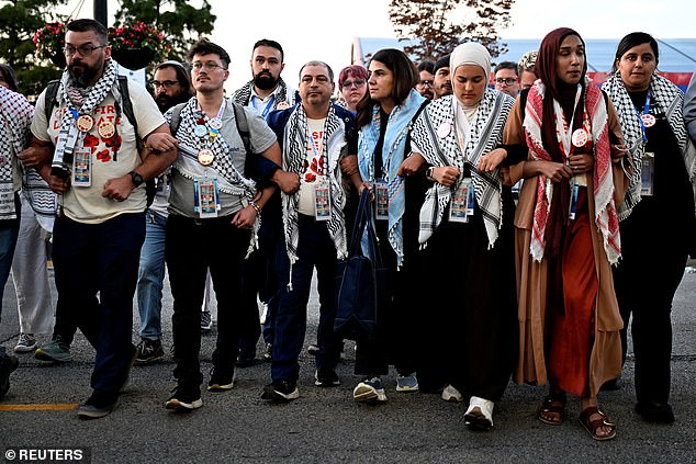 Members of the Uncommitted movement march at the Democratic National Convention. Leaders said Thursday they would not endorse Vice President Kamala Harris, but also encouraged followers not to vote third party, saying it could help former President Donald Trump