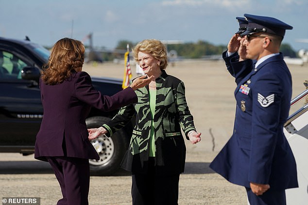 Vice President Kamala Harris (left) greets Michigan Sen. Debbie Stabenow (center) on the tarmac at Joint Base Andrews as they travel to Michigan on Thursday. Michigan is where the Uncommitted Movement's non-endorsement could have the biggest impact