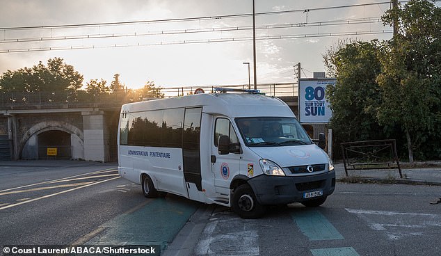 A prison bus arrives at the courtroom in Avignon on September 20