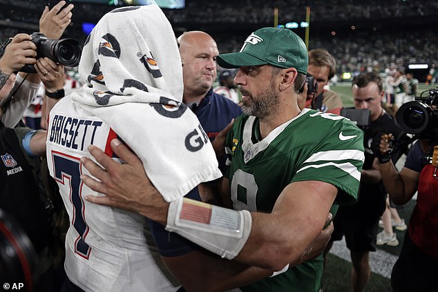 Opposing quarterback Jacoby Brissett received a hug on the field after the Jets' big win