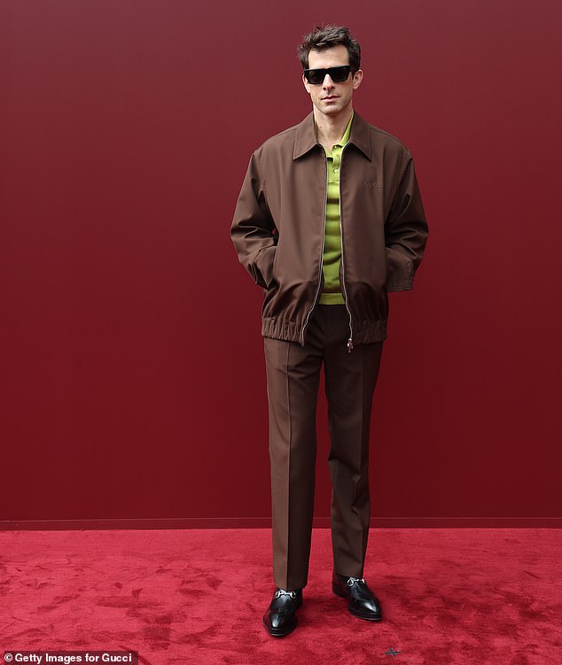 Mark Ronson looked handsome in a smart brown zip-up jacket and matching trousers, teamed with a lime green polo shirt