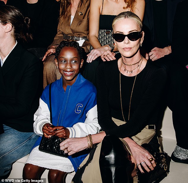 Charlize took August to the Christian Dior pre-fall 2024 fashion show in New York City; seen in April