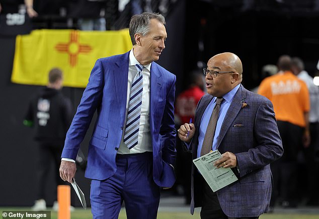 Collinsworth is seen with his live partner, NBC Sports commentator Mike Tirico (right)