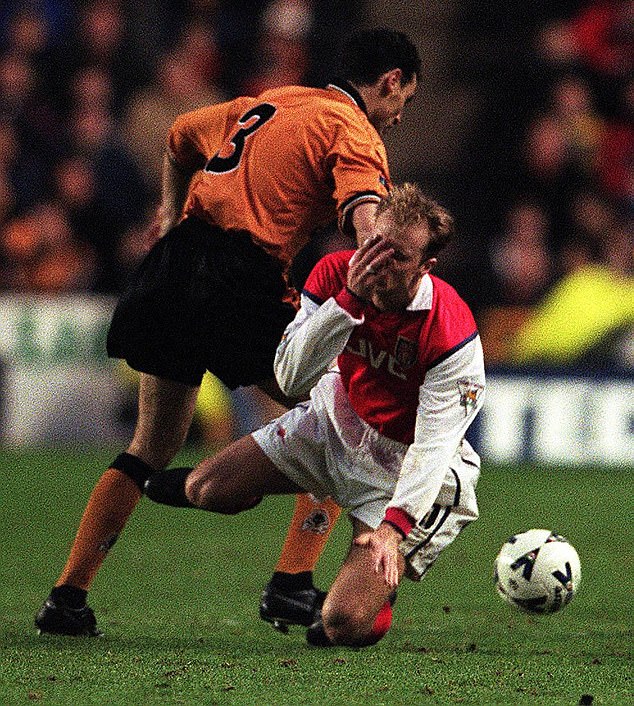 On the pitch, Muscat was a force to be reckoned with (pictured, after a fight with Arsenal legend Dennis Bergkamp while playing for Wolves)