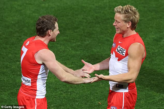 Swans' Harry Cunningham and Isaac Heeney (right) celebrate the final sprint together