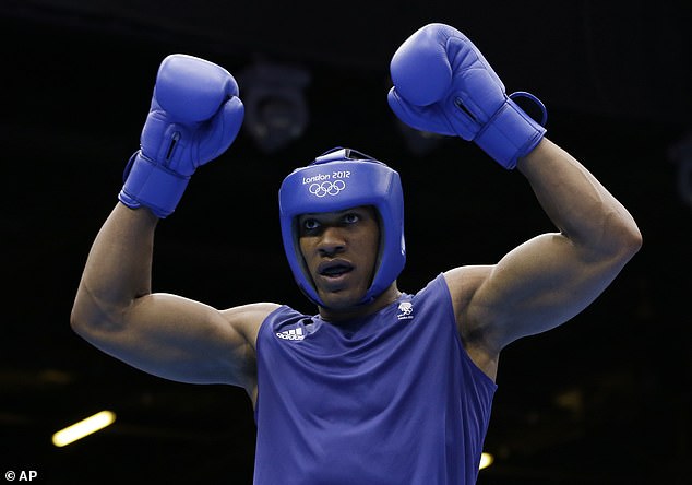 Joshua reacts after defeating Italian Roberto Cammarelle for the gold medal in a 91kg super heavyweight boxing match at the 2012 Summer Olympics