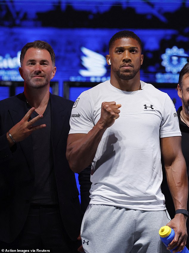 Anthony Joshua and promoter Eddie Hearn pose for a press conference at Wembley Arena in June 2024