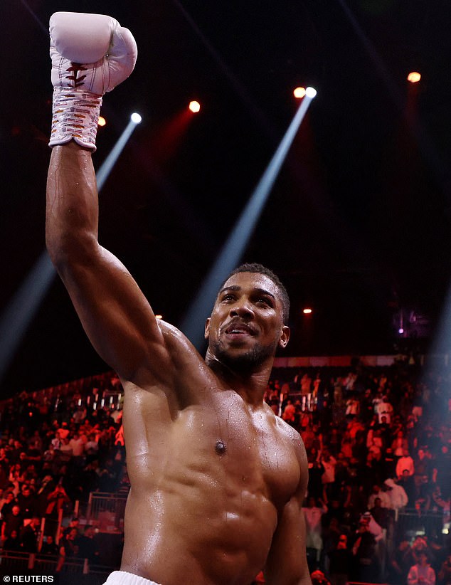 Anthony Joshua celebrates his victory over Otto Wallin in December 2023