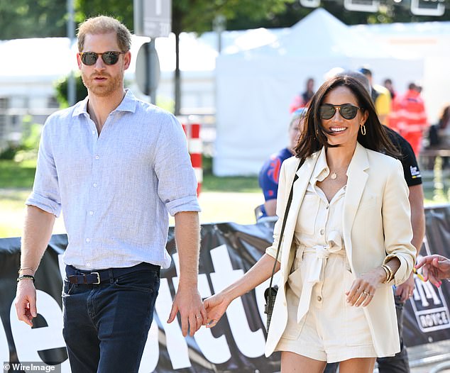 Harry and Meghan attend the cycling medal ceremony at the velodrome during the sixth day of the Invictus Games last year