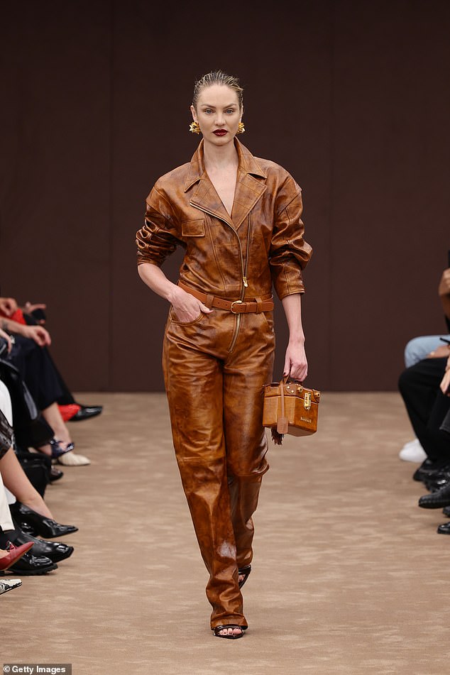 Meanwhile, Candice Swanepoel, 35, looked stunning as she rocked a brown leather jumpsuit on the runway