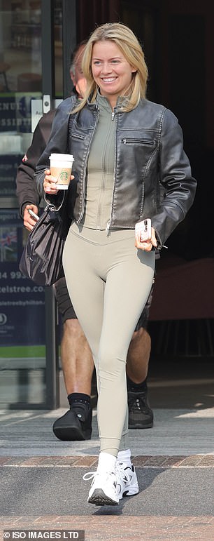 Before heading inside, Tasha showed off her incredible figure in khaki green sportswear and a black leather jacket, while holding a cup of coffee