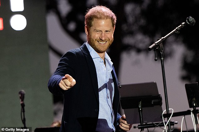 The Duke of Sussex opted for a navy blazer with a light blue shirt as he took to the stage