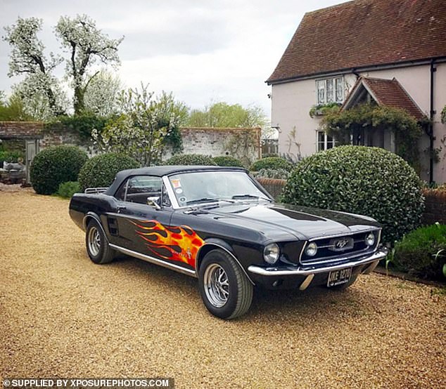 Jamie's fire-painted Ford Mustang is one of the cars in his classic motorcycle collection