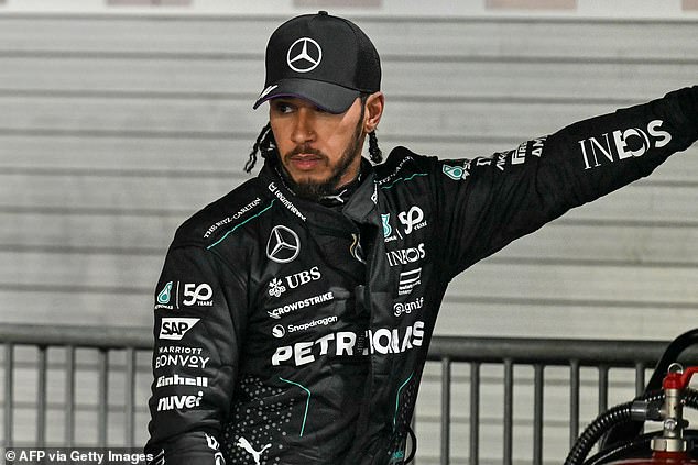 Lewis Hamilton stands on row 2 next to his Mercedes teammate George Russell