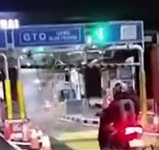 Photo shows the scene after a British tourist drove through a toll gate in Bali