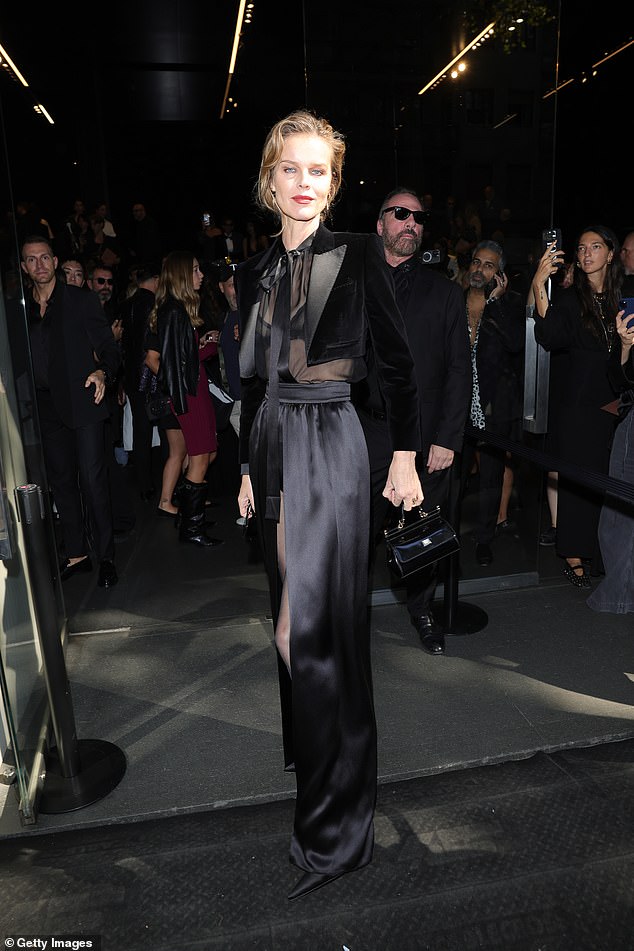 Eva Herzigova looked chic in a black mesh and satin dress