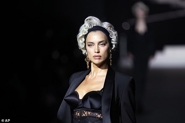 Irina Shayk wore a black pointed bra and blazer, with a gray wig on her head