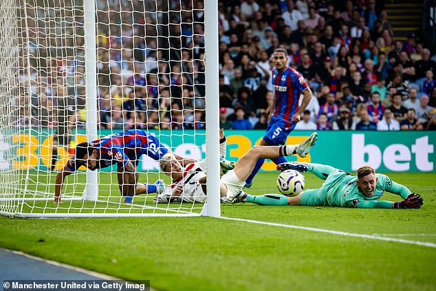 Dean Henderson (right) produced a stunning performance to keep United at bay all afternoon