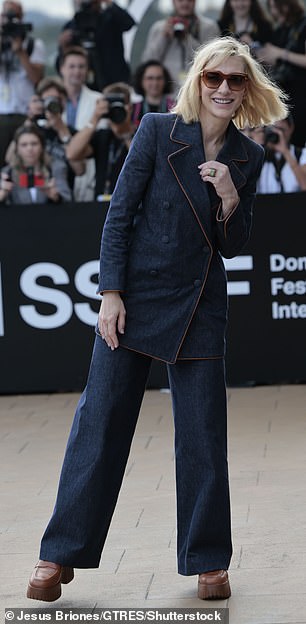 The 55-year-old actress put on a chic show in a denim, double-breasted blazer with tan contrast piping and matching straight-leg jeans