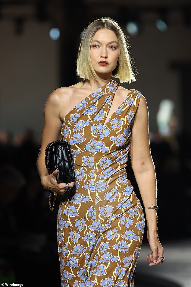 Ms. Law appeared in the fashion show alongside Gigi Hadid (pictured) in a brown and blue floral dress