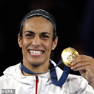 Algerian gold medal winner Imane Khelif poses on the podium