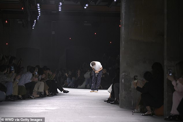 Artistic director Matthieu Blazy takes a bow on the catwalk during the Bottega Veneta show