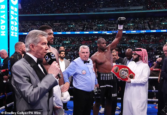 Legendary announcer Michael Buffer calls out a victorious Dubois' name after his victory