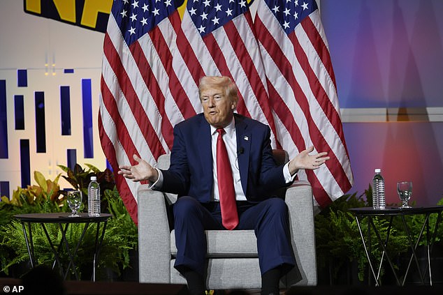 Trump is pictured at the National Association of Black Journalists event in Chicago in July, where he made comments about Harris' race