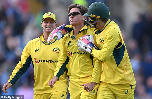 Australian bowler Adam Zampa is congratulated after taking the wicket of Brydon Carse