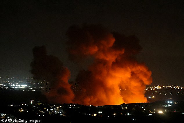 Smoke rises from the site of an Israeli airstrike on the outskirts of the southern Lebanese village of Zawtar. Hezbollah responded yesterday by firing up to 100 rockets into Israeli territory.