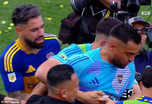 Boca's reserve goalkeeper Leandro Brey pulled his captain away from the angry fan